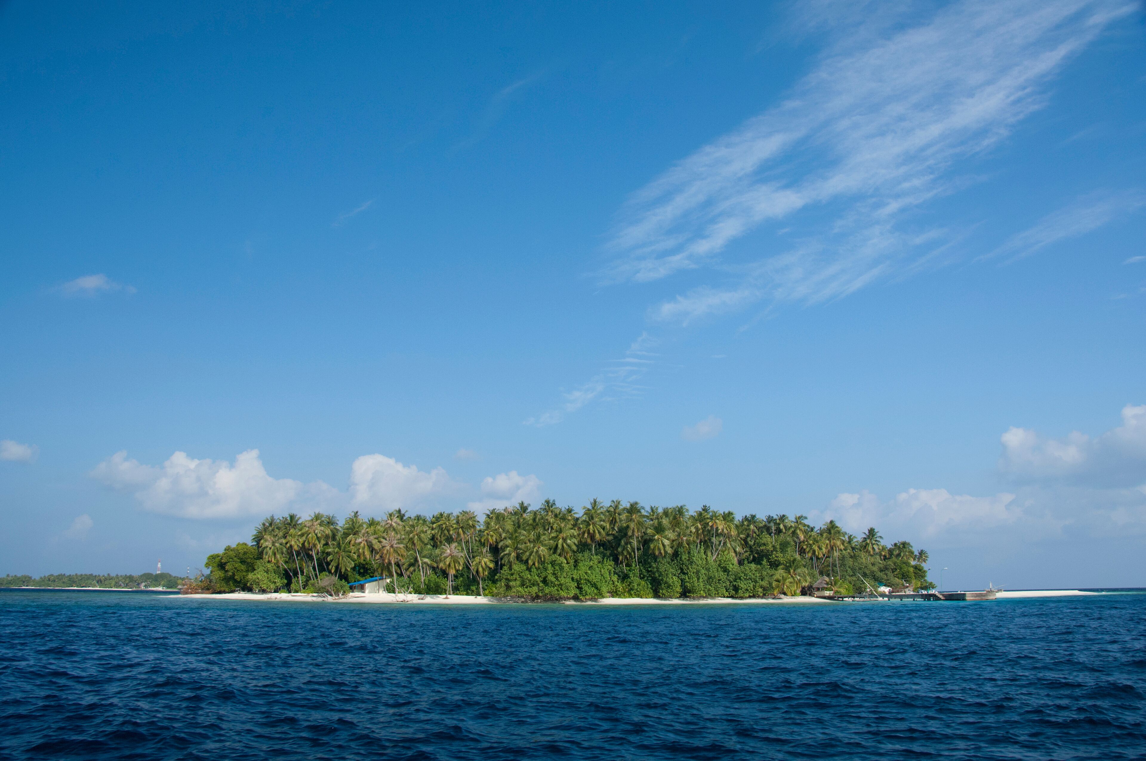 Maldives, North Male Atoll, Island of Kuda Bandos. Resort island of Bandos in the distance.