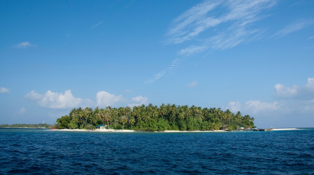 Maldives, North Male Atoll, Island of Kuda Bandos. Resort island of Bandos in the distance.
