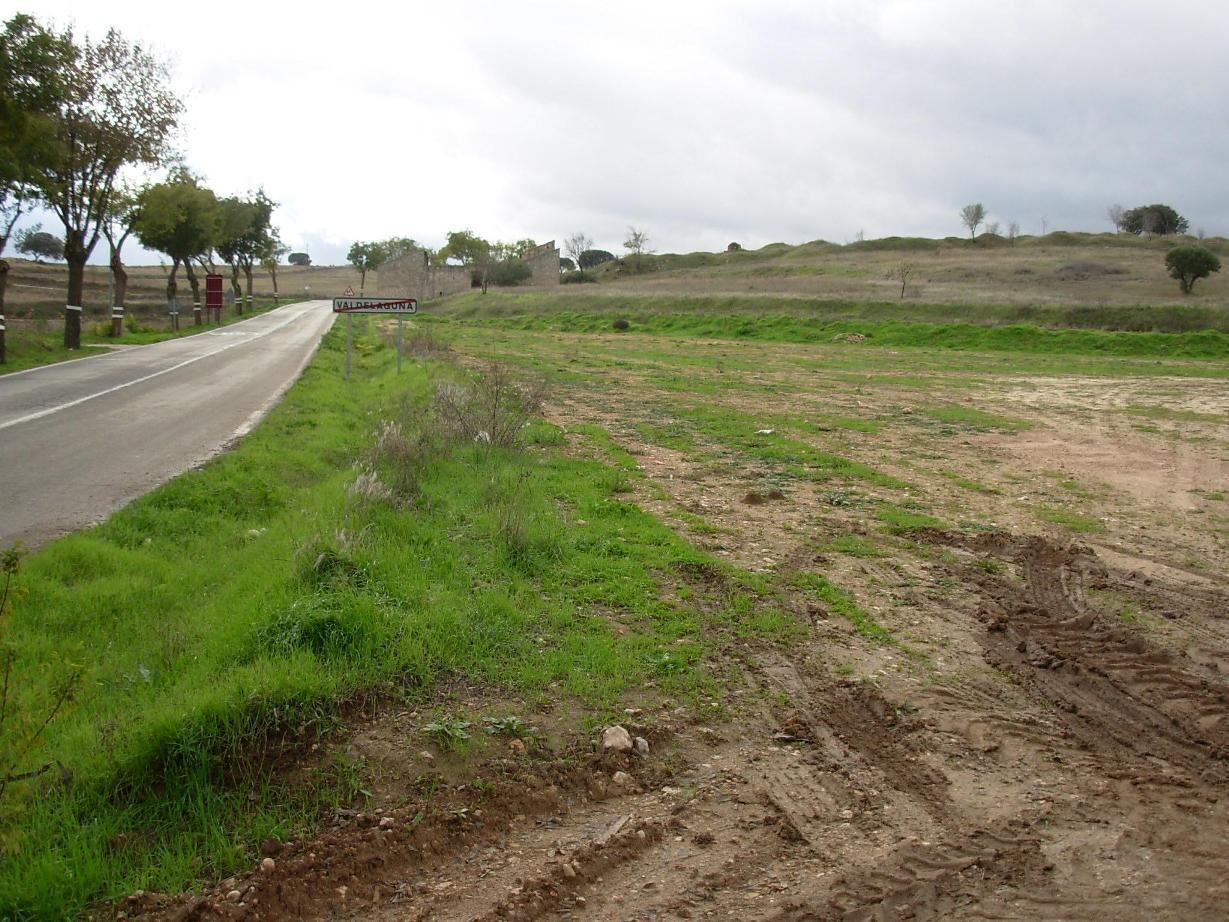 A rural road with a sign for Valdeconcha.