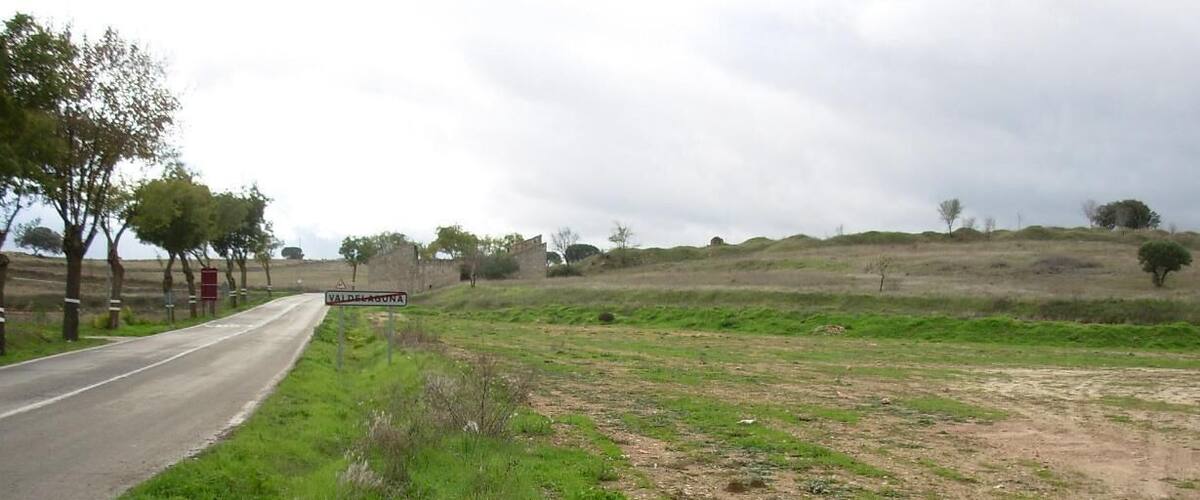 A rural road with a sign for Valdeconcha.