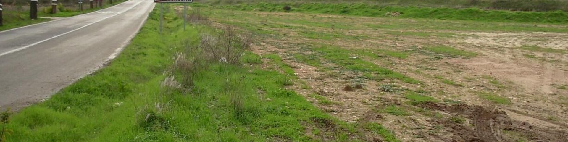 A rural road with a sign for Valdeconcha.