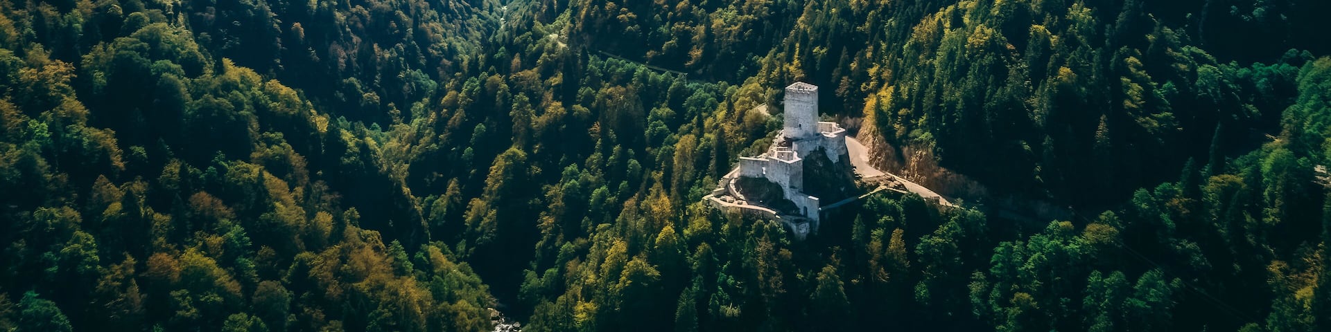 Zilkale, located on a high hill in Rize. Wide angle photo of the castle in the forest area taken with a drone.