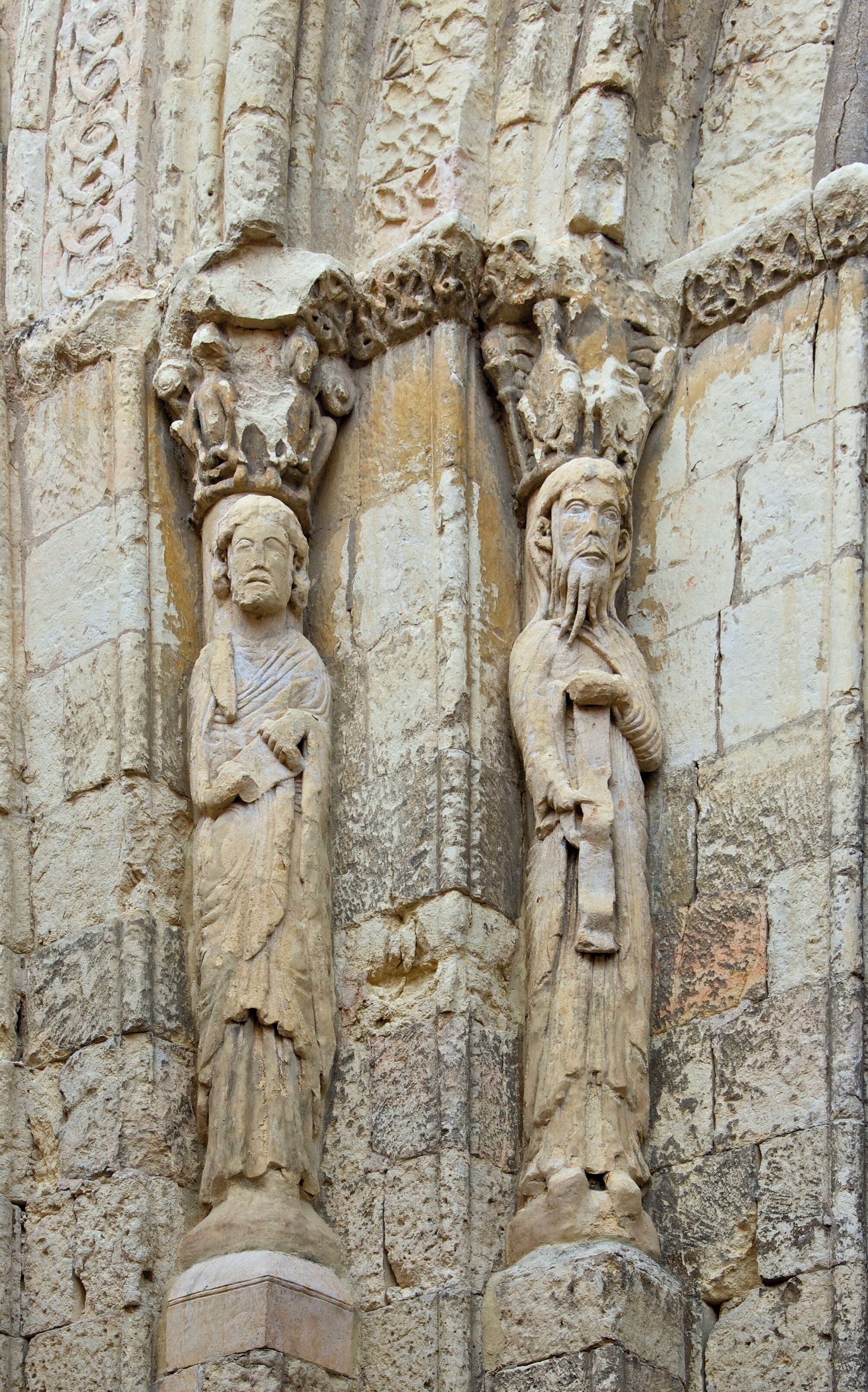 The romanesque statues, left of entrance of Church San Martin, Segovia, Spain.