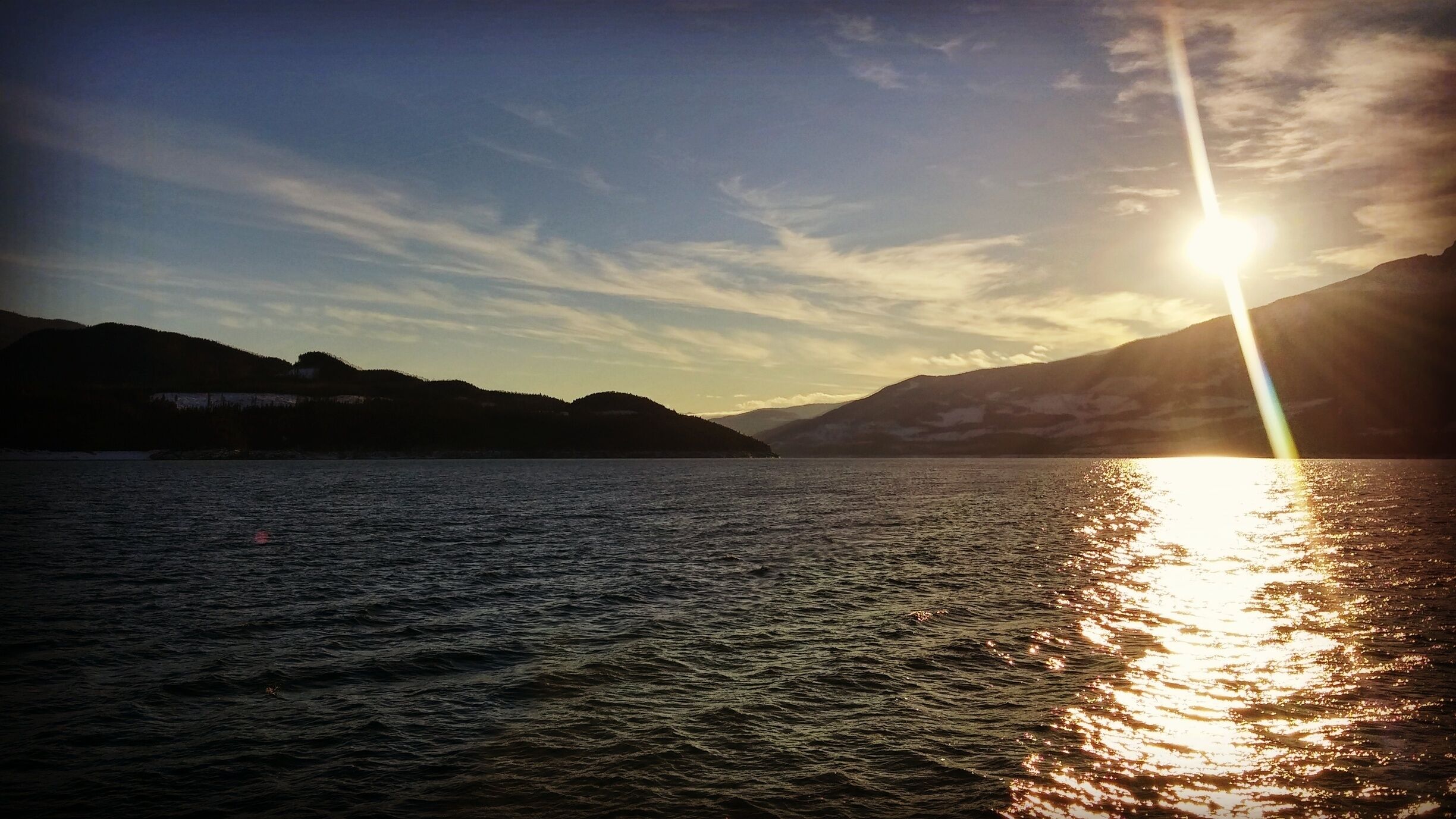 On the ferry at Arrow Lakes watching the sun set. The ferry is quite short as it takes about 15 minutes to cross.