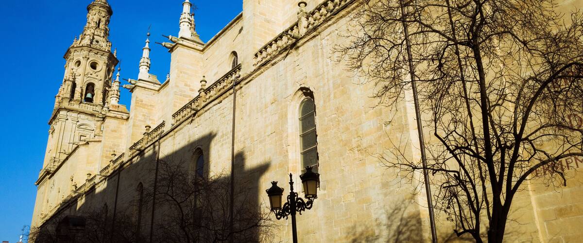 Logroño, La Rioja, Spain - February, 15th, 2019 : South facade of the Co-Cathedral of Santa María de la Redonda along Calle Portales street.