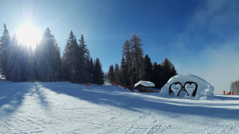 Beautiful Panoramic View of Forest, Ski Trail And Bright Sun in Mountains. Tarentaise Savoie French Alps. Love For Mountains.