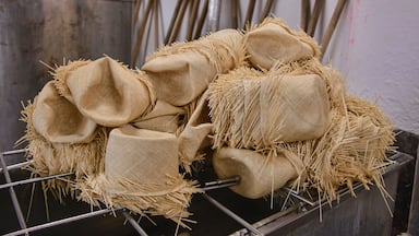 Making and shaping traditional Panama hats (paja toquilla), which actually come from Ecuador.