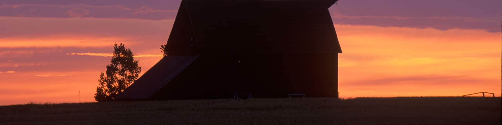Barn at sunset in silhouette, Davenport, WA