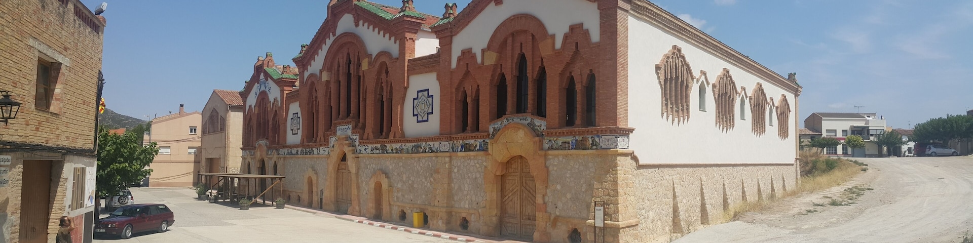 A historic church with arched windows and a tiled facade.