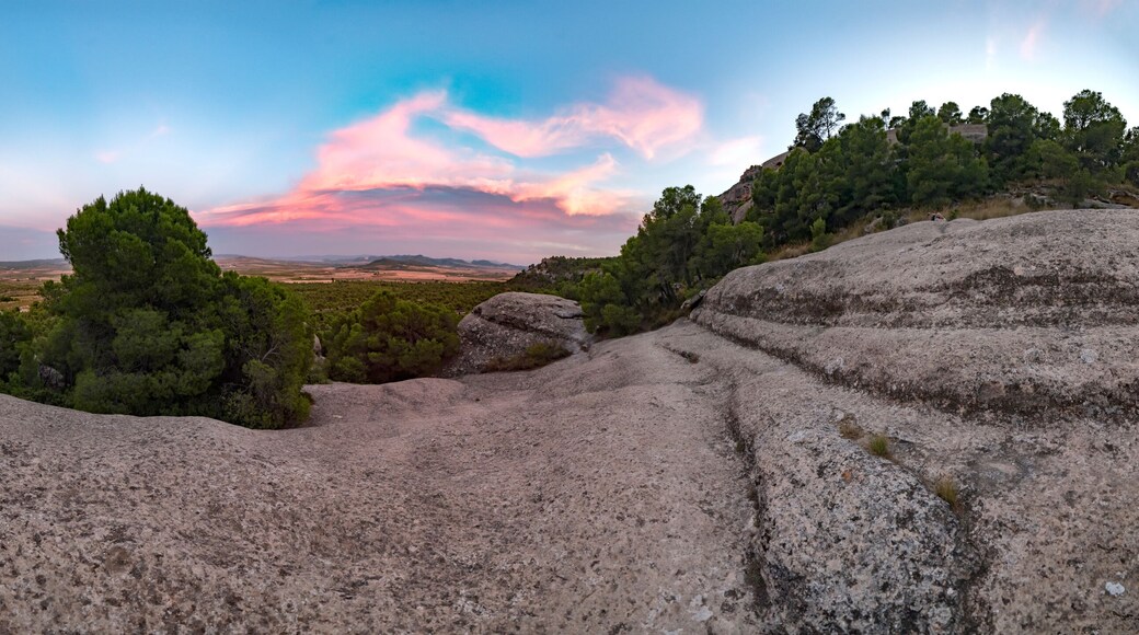 Pink sunset from an ancestral mountain, Mount Arabi, Yecla, Spain. Panoramic of a sunset in the mountains. Privileged views from a rock valley