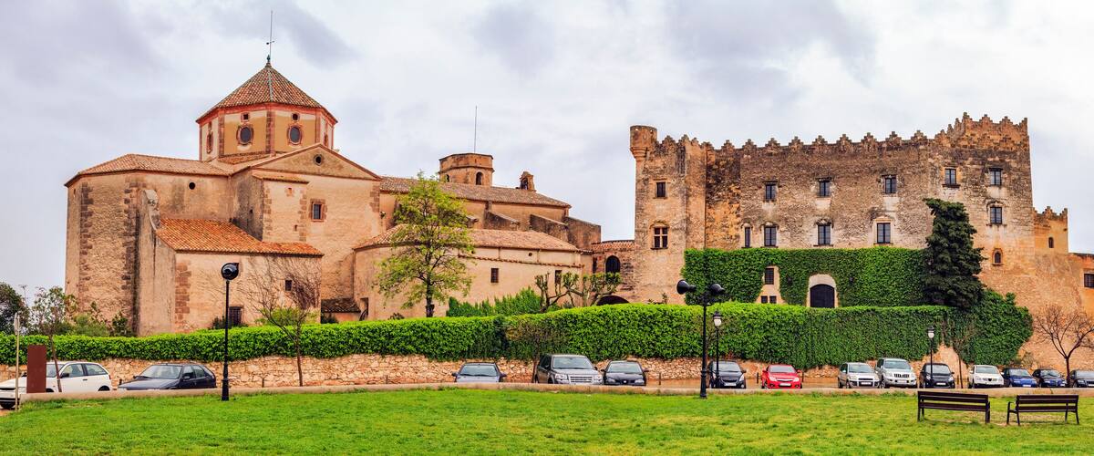 A historic building with a tower and a castle-like structure.