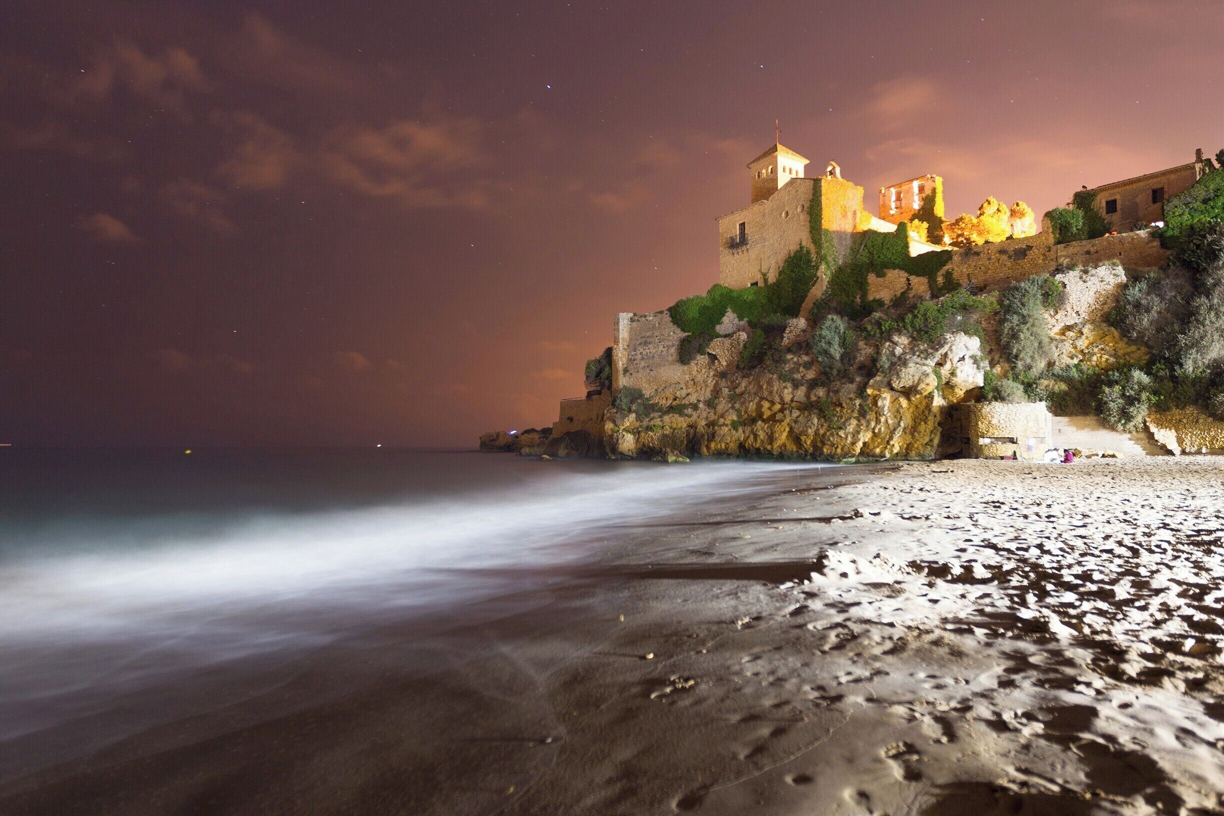 Tamarit Castle standing on the edge of the water. There's a great beach and campsite situated next to it.