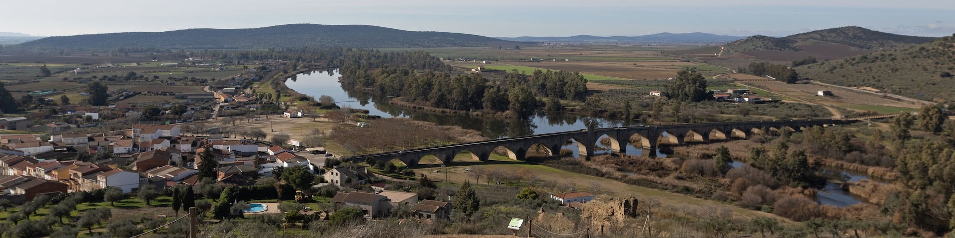 Landscape view of the ancient historic Roman bridge over the Guadiana river in Medellin Spain, a Spanish municipality in the province of Badajoz, in the autonomous community of Extremadura Spain.