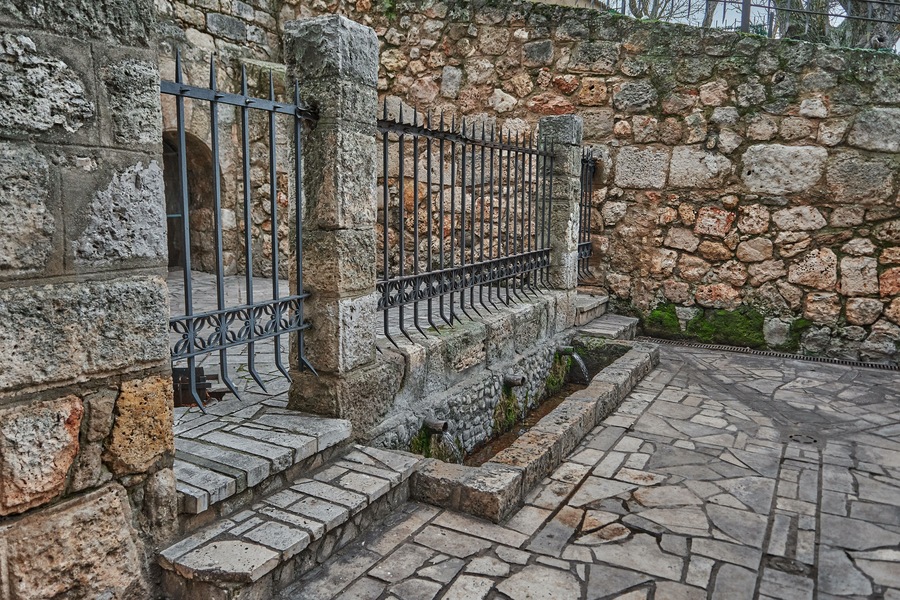 Natural spring water, where fresh and pure water comes from. Concept: nature, purification, freshness. San Juan Fountain. Jewel of Visigoth art. Declared of Cultural Interest in Baños de Cerrato, Palencia, Spain