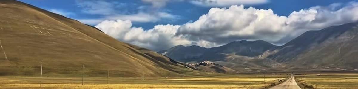 At the end of the this road and perched on a hill on the left is the small and very remote town of Castelluccio. To get there, you must drive around several mountains and across the "Piano Grande", a plateau at 4,000ft created by a glacial lake. It is now open farmland and one of the most scenic drives we have taken in Italy!