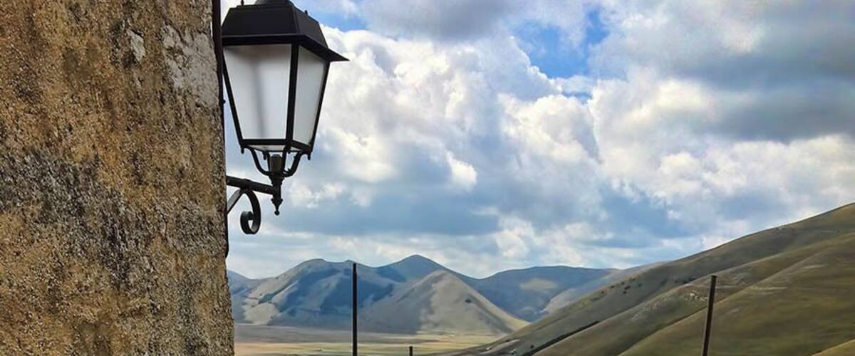 The drive to Castelluccio is itself famed and remarkable, but a visit to the small town at the end of the journey is a must (don't just turn around!)
It's a maze of twisty roads uphill, but taking the time to walk them means many hidden viewpoints to be discovered. It's quiet, very few tourists make it this far, and might even be worth a stay for a couple of days.