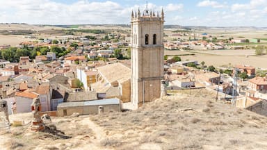 a view over Baltanas town with the Parish Church of San Millan in the foreground, province of Palencia, Castile and Leon, Spain