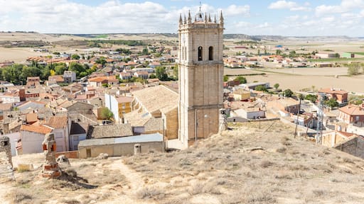 a view over Baltanas town with the Parish Church of San Millan in the foreground, province of Palencia, Castile and Leon, Spain