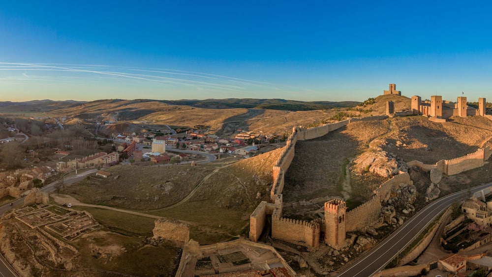 Molina de Aragon classic medieval Spanish ruined castle aerial panorama view at sunset close to Guadalajara Spain