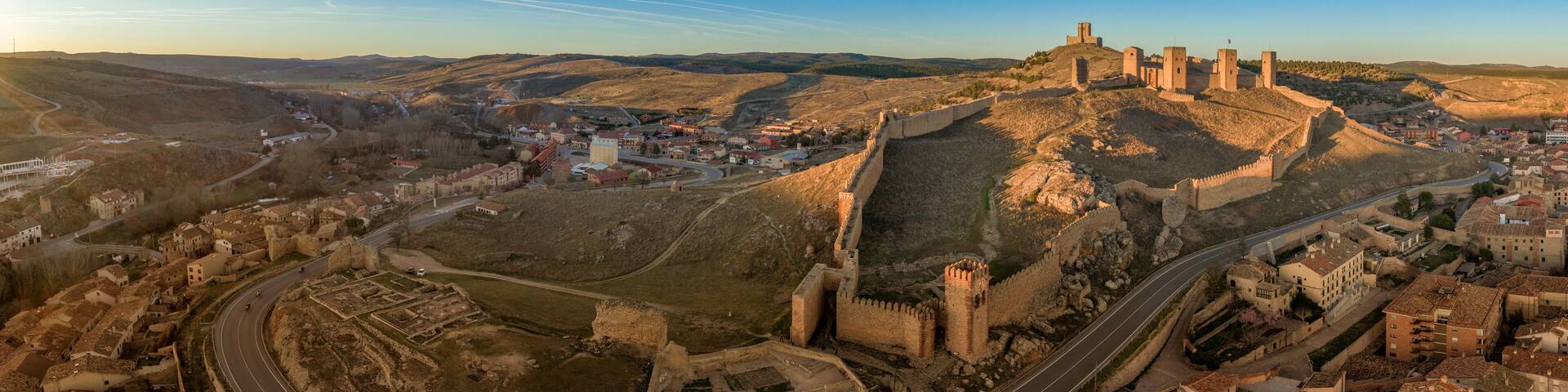 Molina de Aragon classic medieval Spanish ruined castle aerial panorama view at sunset close to Guadalajara Spain