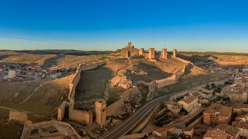 Molina de Aragon classic medieval Spanish ruined castle aerial panorama view at sunset close to Guadalajara Spain