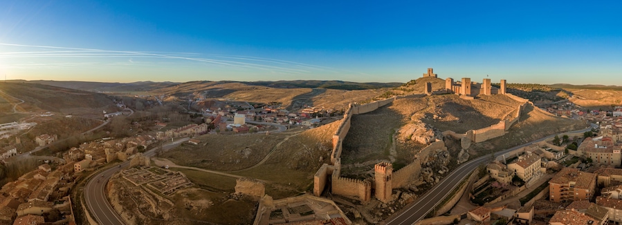 Molina de Aragon classic medieval Spanish ruined castle aerial panorama view at sunset close to Guadalajara Spain