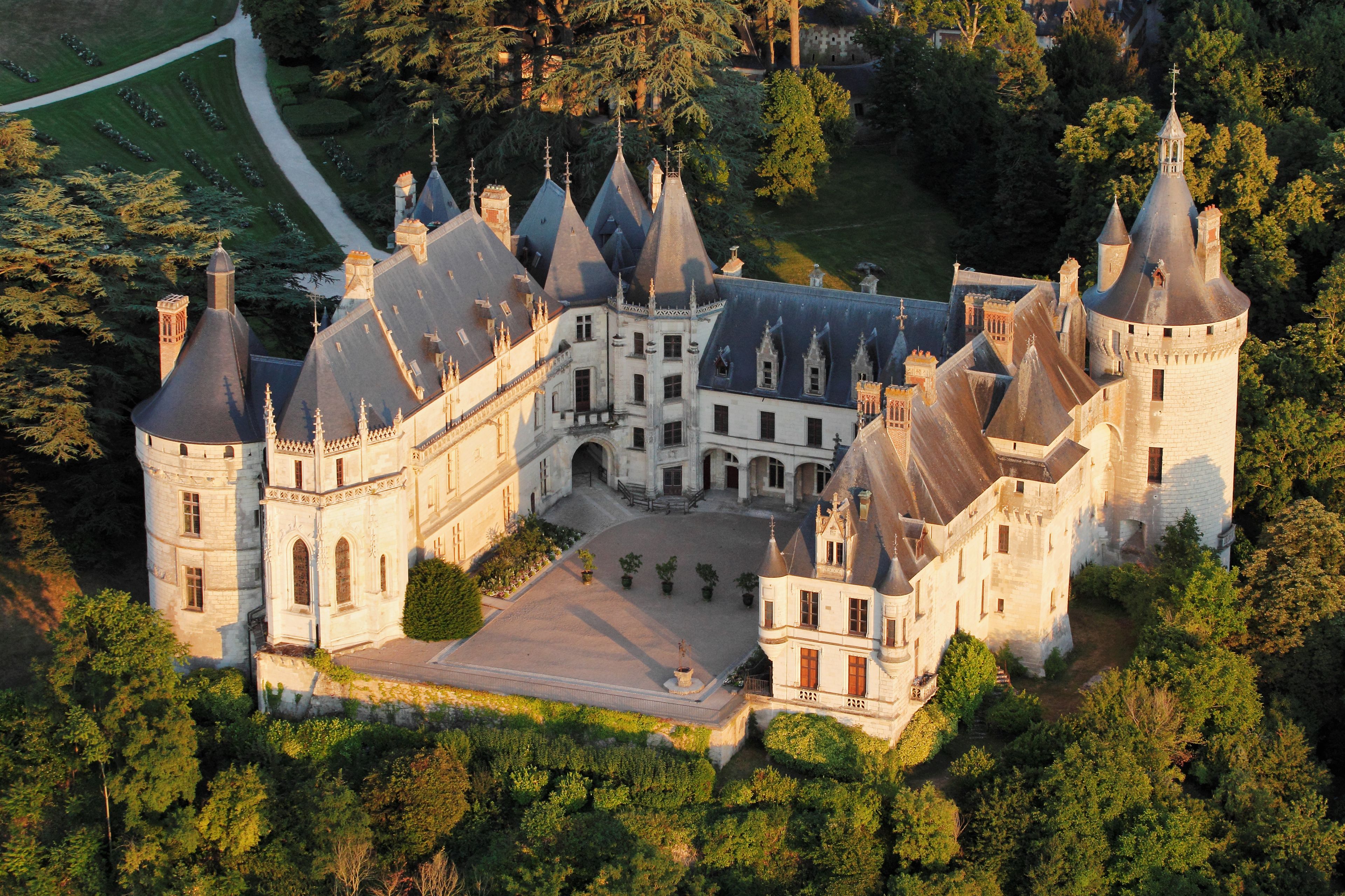 A large, historic castle with multiple towers and a central courtyard.