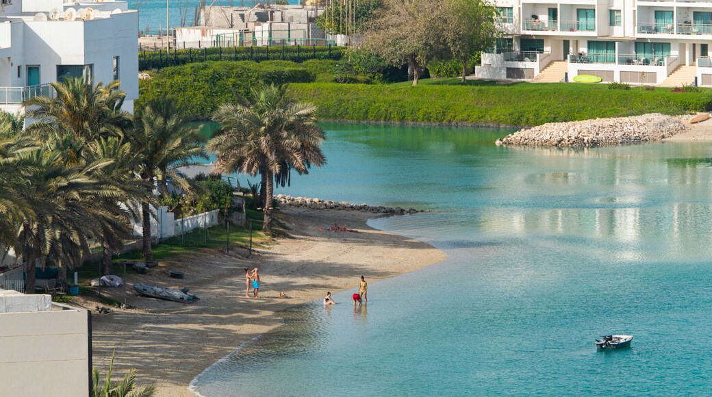 Amwaj Islands showing a coastal town, swimming and a bay or harbor