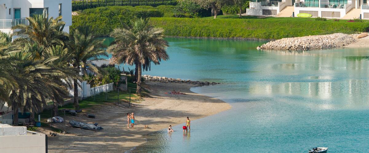 Amwaj Islands showing a coastal town, swimming and a bay or harbor