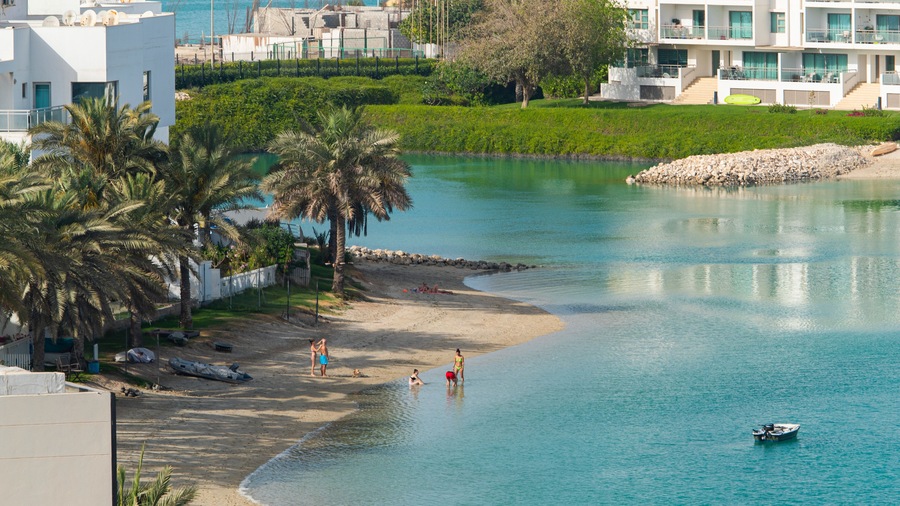 Amwaj Islands showing a coastal town, swimming and a bay or harbor