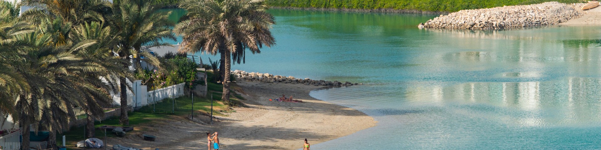 Amwaj Islands showing a coastal town, swimming and a bay or harbor