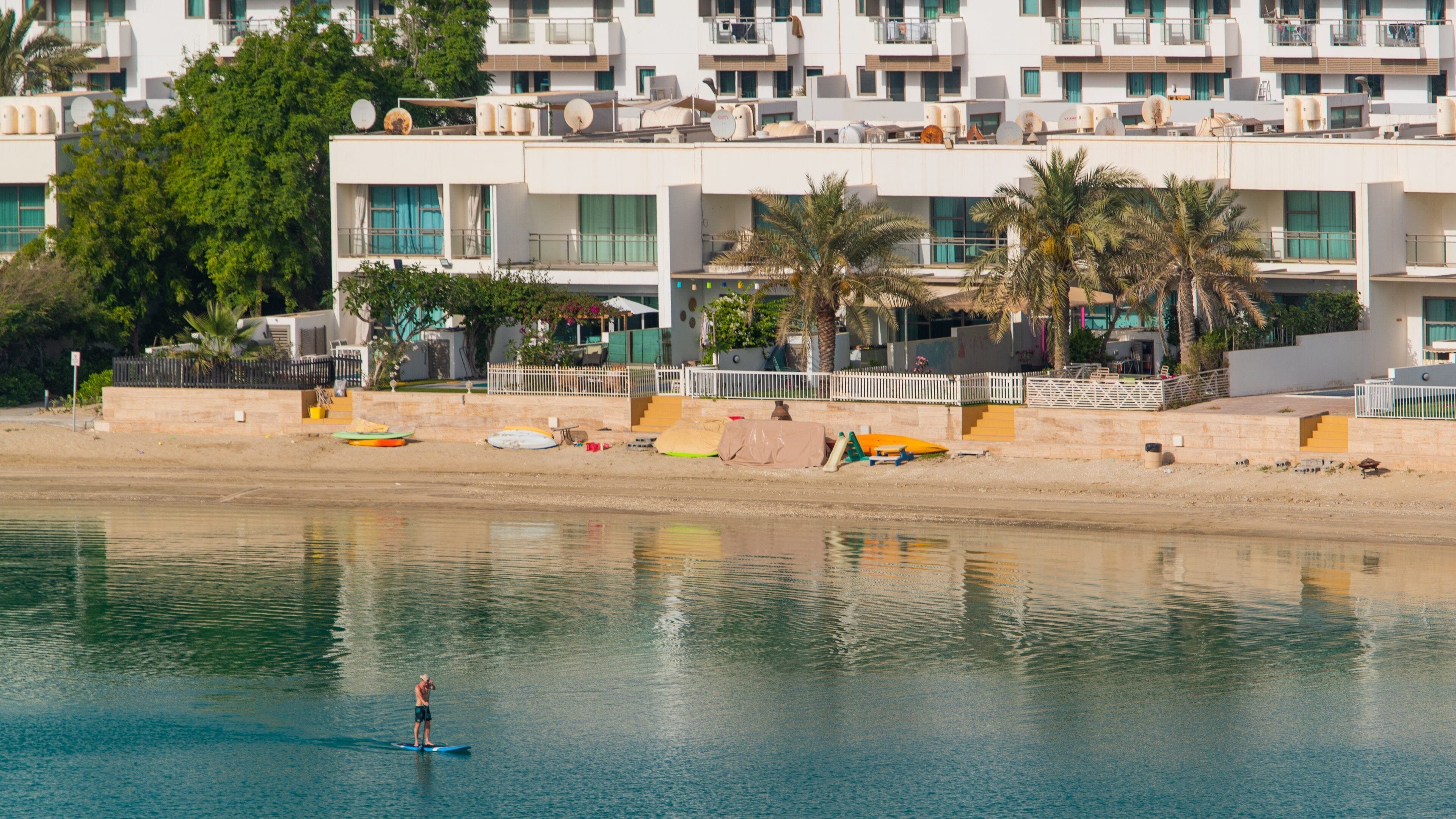 Amwaj Islands which includes a coastal town, general coastal views and kayaking or canoeing