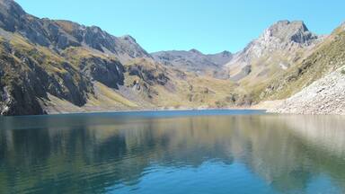 A mountain lake surrounded by rocky terrain.