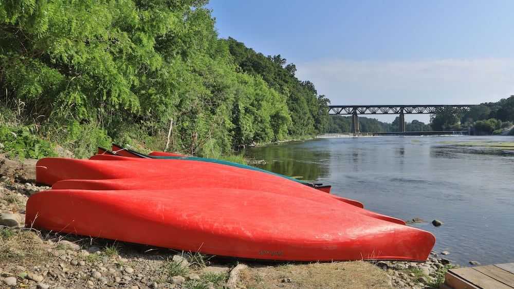 Grand River at Paris, Ontario, Canada with canoes in foreground