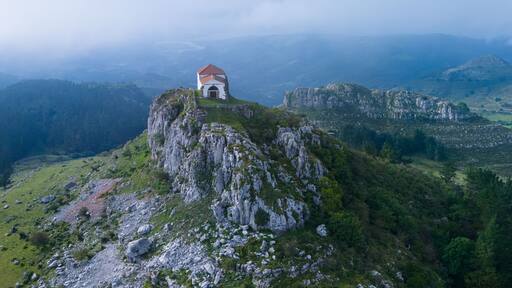 Aerial view from a drone of the Hermitage of Our Lady of the Snows between Ampuero and the Guriezo Valley in the Asón-Agüera region. Cantabria, Spain. Europe