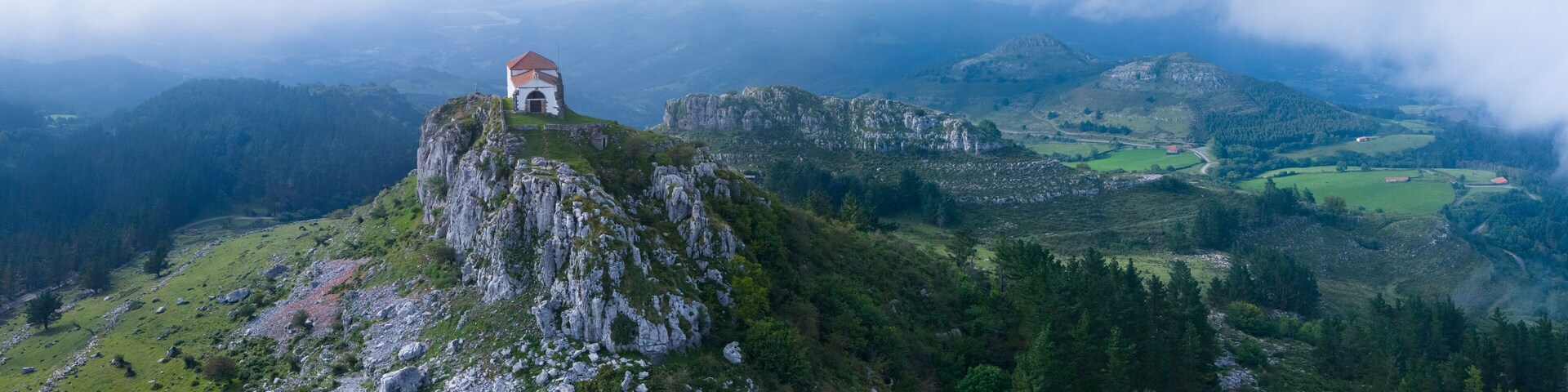 Aerial view from a drone of the Hermitage of Our Lady of the Snows between Ampuero and the Guriezo Valley in the Asón-Agüera region. Cantabria, Spain. Europe