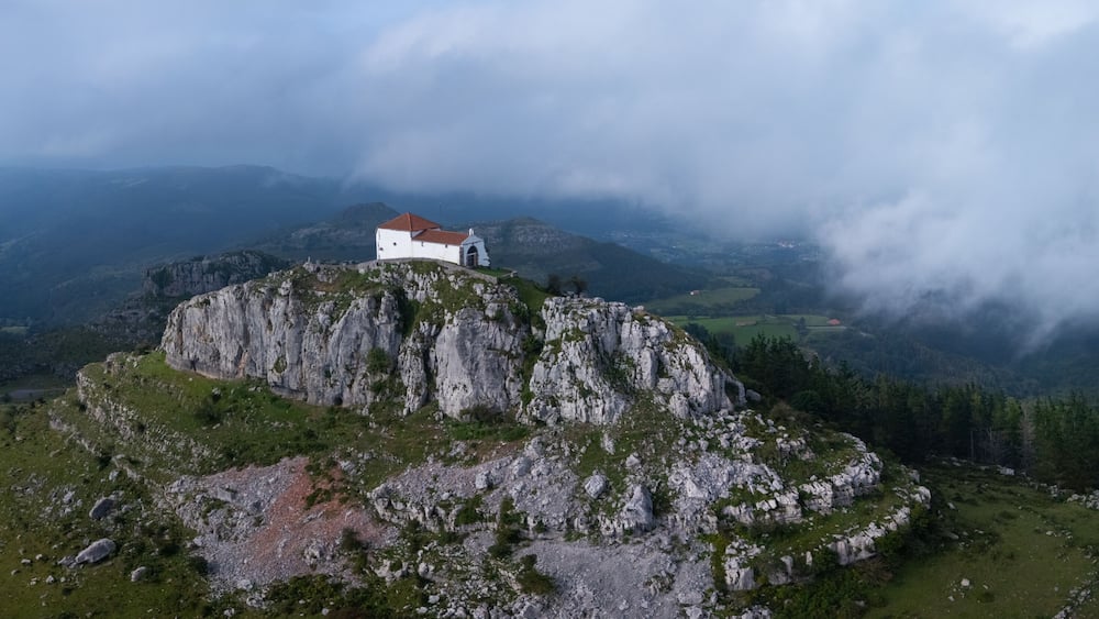 Aerial view from a drone of the Hermitage of Our Lady of the Snows between Ampuero and the Guriezo Valley in the Asón-Agüera region. Cantabria, Spain. Europe
