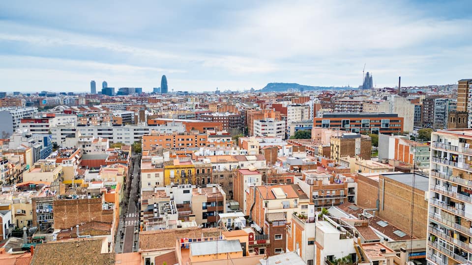 Aerial view of the Sant Andreu neighborhood in Barcelona with residential buildings and streets. Concept of housing crisis in Spain