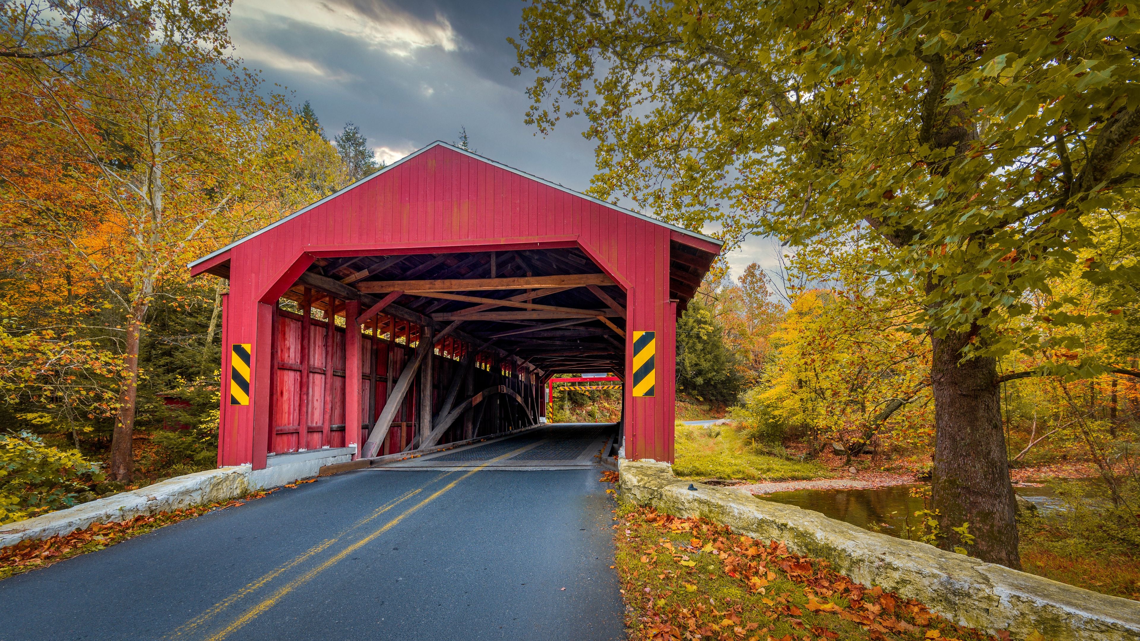A rustic, red covered bridge in Eastern Pennsylvania in autumn
