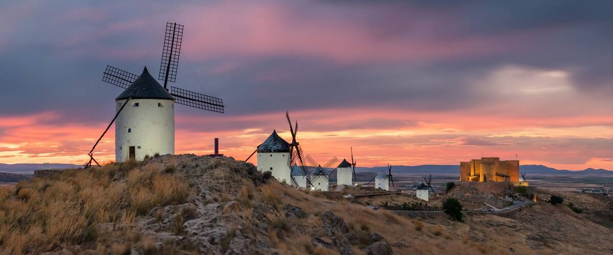 Historic windmills of Consuegra at sunset, Castilla-La Mancha, Spain.