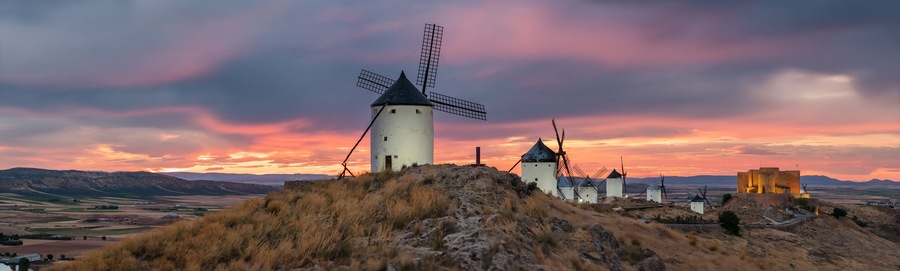 Historic windmills of Consuegra at sunset, Castilla-La Mancha, Spain.