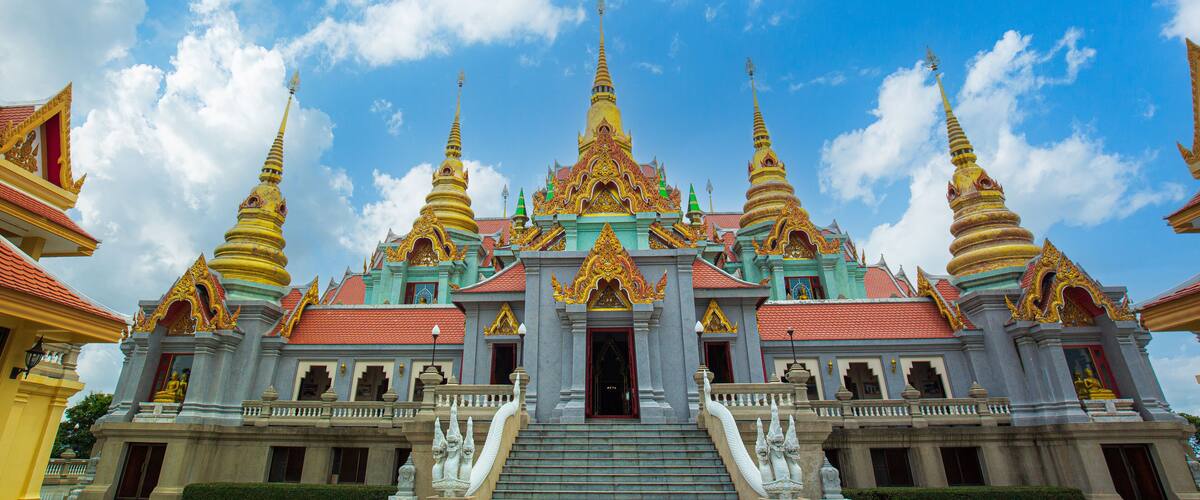 A temple with multiple golden spires and a central main building.