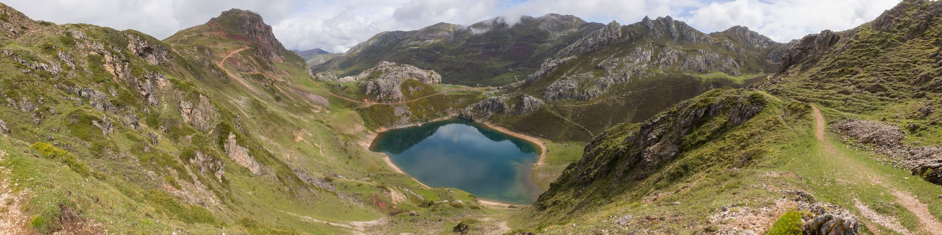 View of a lake from the top of the mountain in Somiedo, Spain
