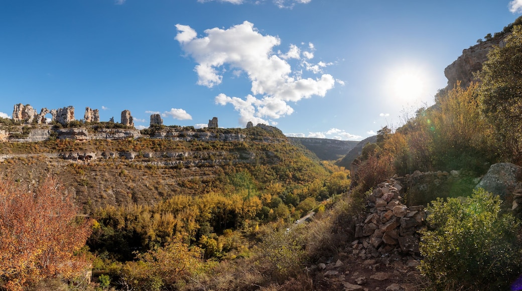 Panoramic Landscape of Orbaneja del Castillo, Spain, with Cliffs and Autumn Forest