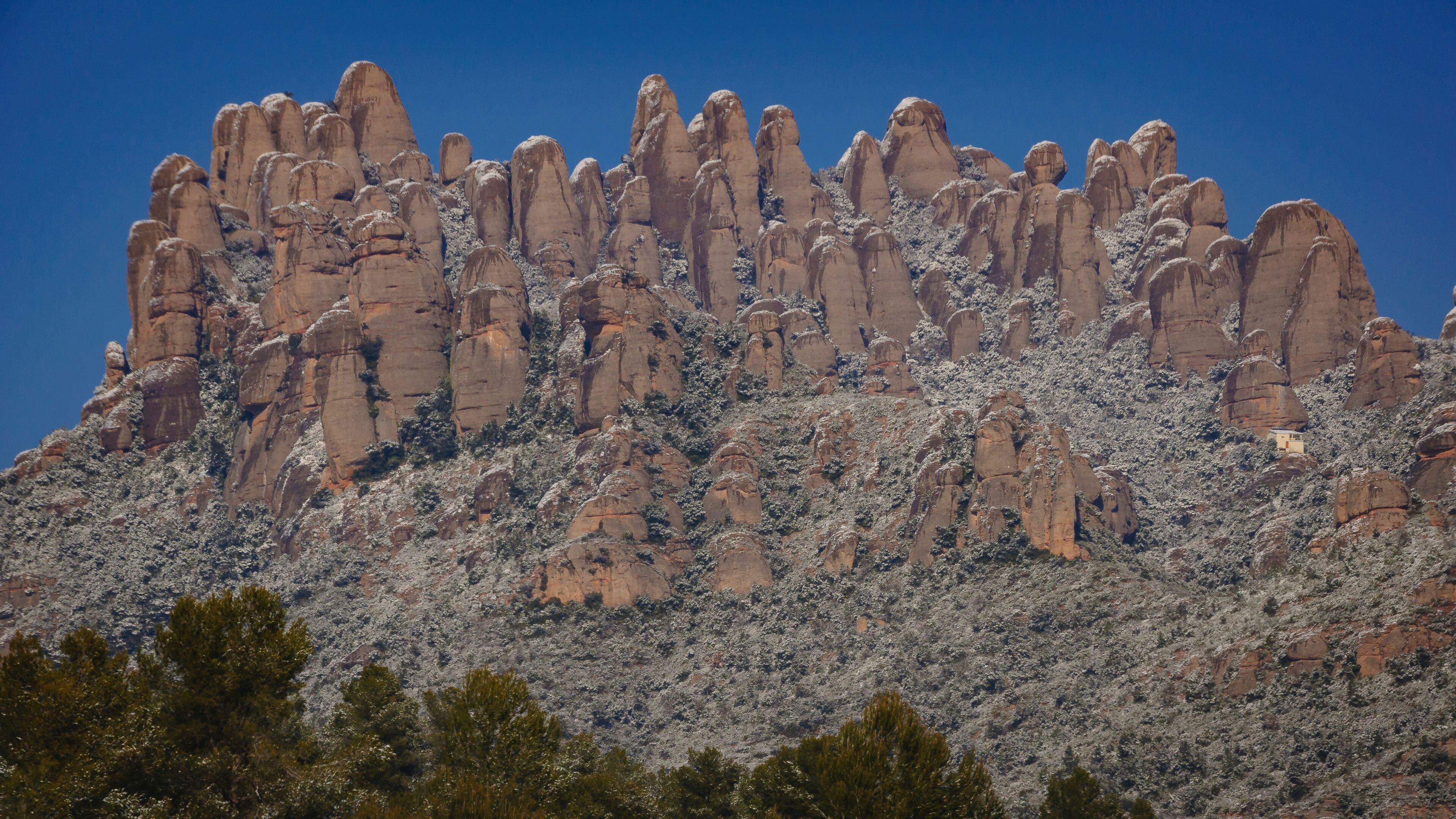 Snowy Montserrat mountains in winter, seen from El Bruc (Anoia, Barcelona, Catalonia, Spain)