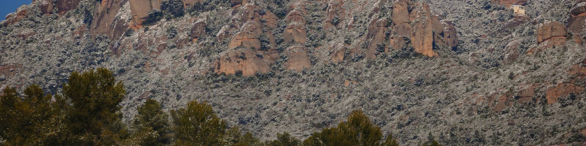 Snowy Montserrat mountains in winter, seen from El Bruc (Anoia, Barcelona, Catalonia, Spain)