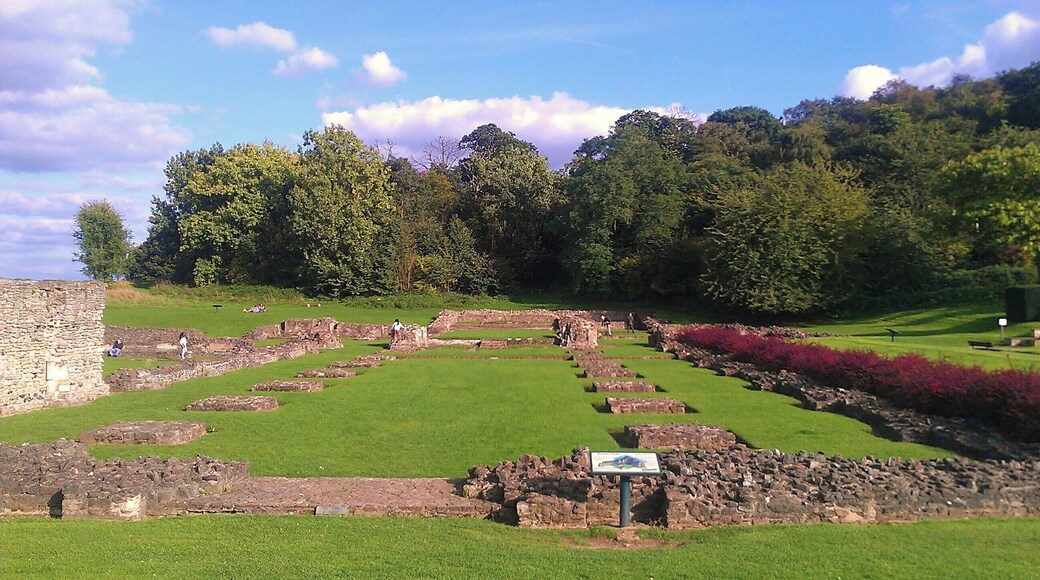 The remains of Lesnes Abbey in southeast London. Depicted here is the nave from its western end, facing east. Lesnes Abbey Wood is visible in the background.