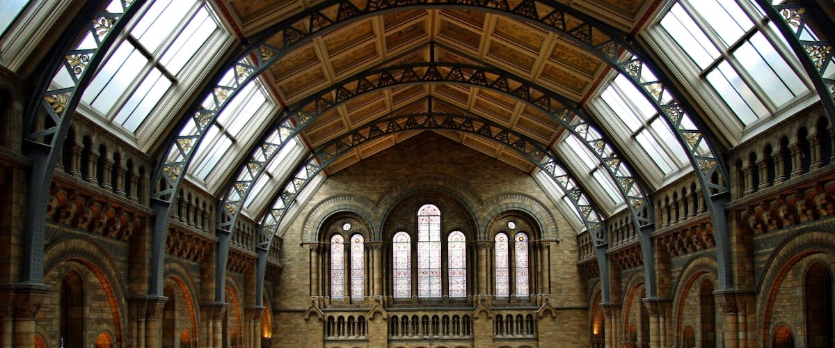 A grand building with arched windows and a high ceiling.