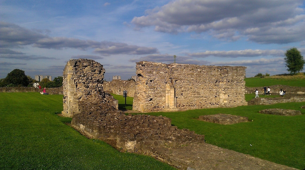 The remains of Lesnes Abbey in southeast London. The low remains of the wall in the front of the image represent the western end of the nave; the taller walls separated the nave from the outside of the building.