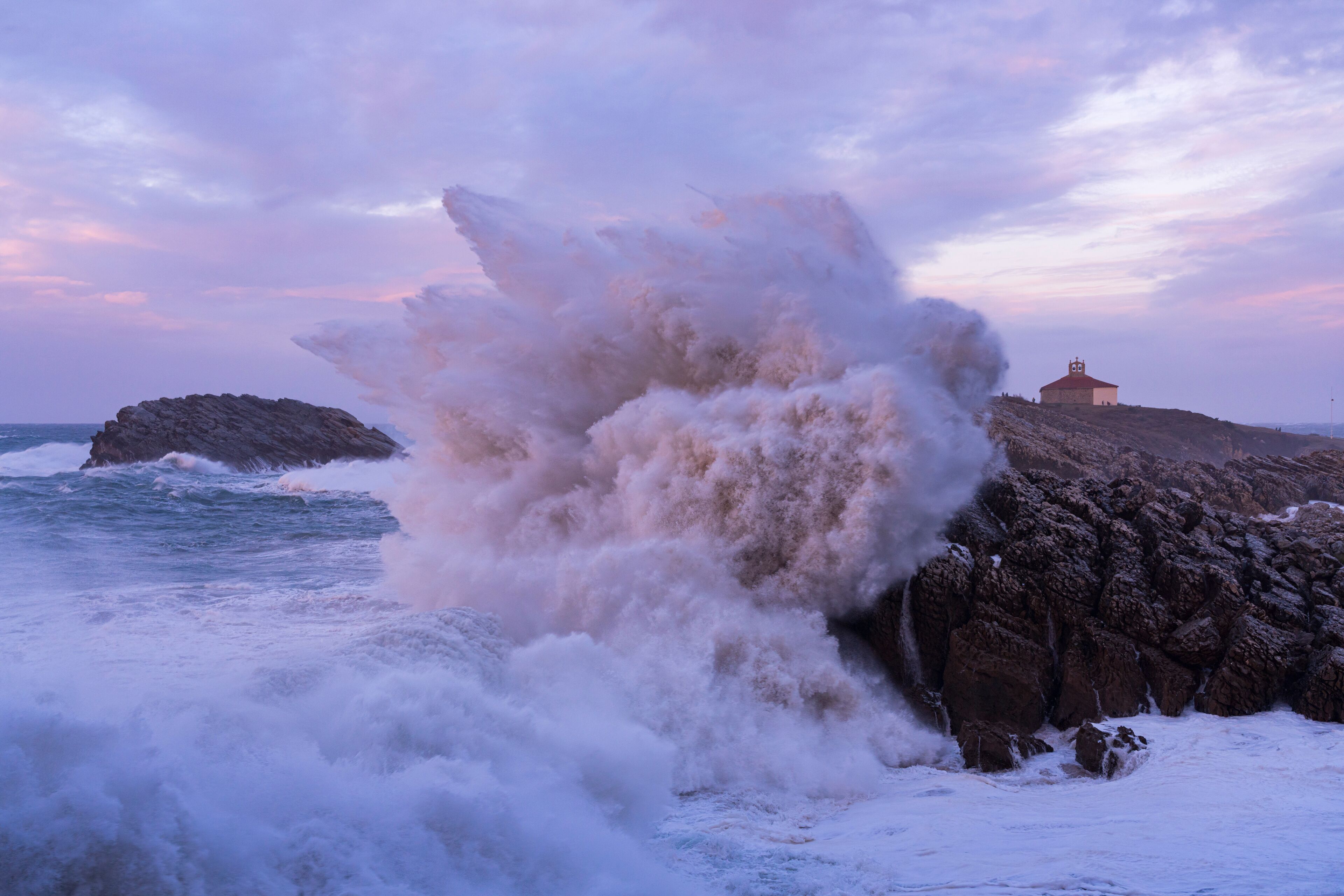 Swell and storm in the Hermitage of the Virgen del Mar San Roman de la Llanilla.Municipality of Santander. Virgen del Mar Island in the Cantabrian Sea. Autonomous Community of Cantabria. Spain. Europe